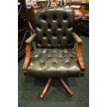A GREEN BUTTON BACKED LEATHER OFFICE CHAIR, swivel chair, on a four leg base, 39" x 24" x 21"