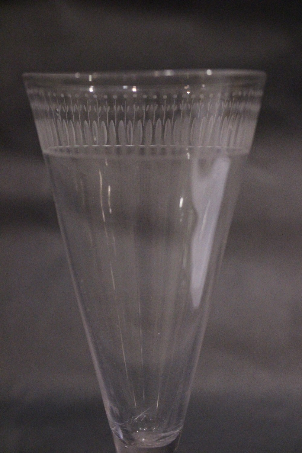 A TAPERED GLASS FLUTE, with cut detail to the rim, raised on a lemon squeeze foot / base, 7" tall - Image 2 of 4