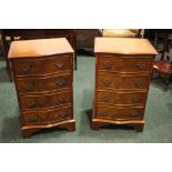 A PAIR OF SERPENTINE SHAPED WALNUT 4 DRAWERS CHESTS, cross-banded detail, raised on bracket feet,