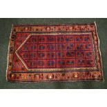 A SMALL HAND KNOTTED WOOLEN PRAYER RUG, 50" x 33" approx