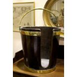 AN IRISH BRASS BOUND ‘PLATE’ BUCKET, with brass handle, 15.5” tall, 15” wide approx