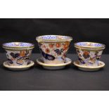A SET OF 3 'IMARI' STYLE CUPS / VESSELS, each with a saucer and hole to the base, 2 with cork