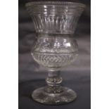 AN IRISH REGENCY CUT GLASS CELERY VASE, a fine thistle shaped body, with serrated rim, and stepped/
