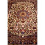 A VERY GOOD QUALITY FLOOR RUG, with central medallion, main central ground cream with red & blue 55"