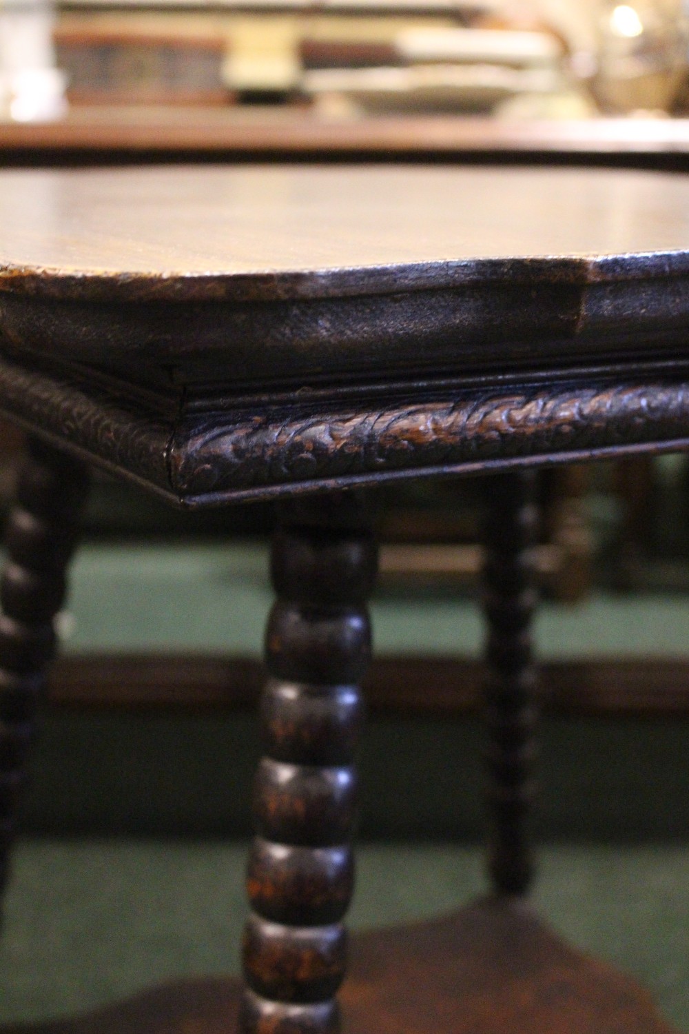 A 19TH CENTURY SERPENTINE SHAPED SIDE TABLE, raised on bobbin turned legs, united by a lower