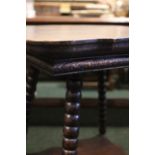 A 19TH CENTURY SERPENTINE SHAPED SIDE TABLE, raised on bobbin turned legs, united by a lower