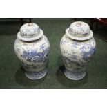 A PAIR OF BLUE & WHITE 'DRAGON' GINGER JARS, with lids