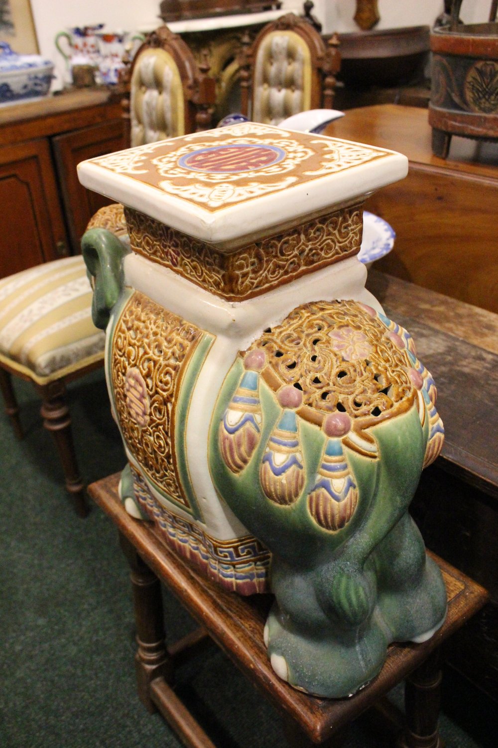 A CERAMIC JARDINERE / POT STAND IN THE FORM OF AN ELEPHANT, dressed in robes with a square seat as - Image 5 of 5