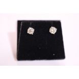 A PAIR OF 18CT WHITE GOLD DIAMOND STUD EARRINGS, 1.10 cts