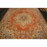 A LARGE ‘KESHAN’ WOOL FLOOR RUG, with central medallion motif and multi border, 12ft x 9ft approx,