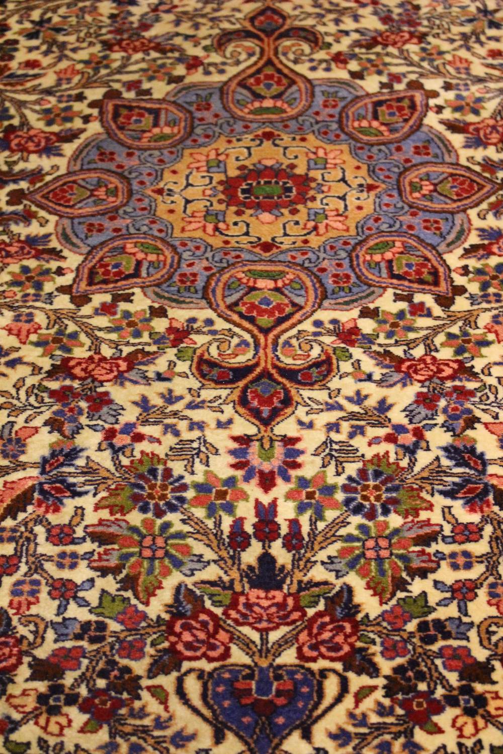 A VERY GOOD QUALITY FLOOR RUG, with central medallion, main central ground cream with red & blue 55" - Image 2 of 2