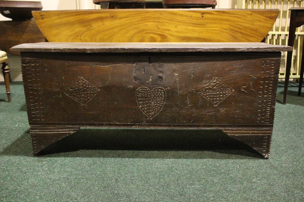 AN OAK COFFER CHEST / MARRIAGE CHEST, with carved initials to the front and a love heart motif to