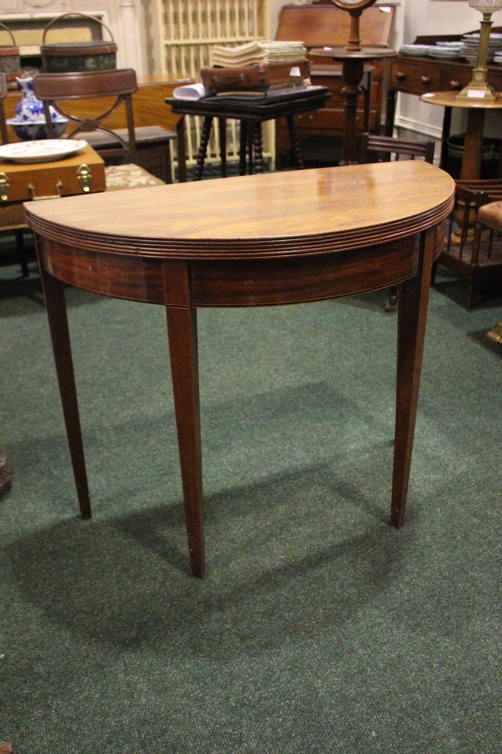 A GOOD QUALITY DEMI-LUNE FOLD OVER CARD TEA TABLE, with reeded rim, raised on tapered leg, having - Image 2 of 5