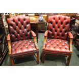 A PAIR OF BUTTON BACKED RED LEATHER ARM CHAIRS, with reeded square legs