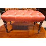 A VERY FINE BUTTON TOPPED LEATHER FOOT STOOL, raised on turned tapered leg, 36" x 18" x 19" approx