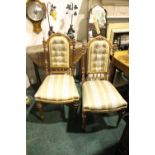 A PAIR OF SIDE CHAIRS, with carved and turned button back supports, raised on fluted and turned