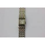 A lady's 14ct bracelet watch with gem set dial 34.5g gross