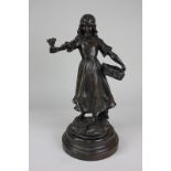 After A J Scolle, a bronze figure of a female flower seller, 40cm high