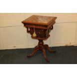 A Victorian walnut games / sewing table with inlaid chequerboard top enclosing fitted interior and