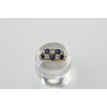 A sapphire and diamond ring set with five old cut diamonds and five sapphires