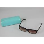 A pair of Tiffany & Co tortoiseshell effect lady's sunglasses in original case