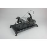 A bronzed metal model of a horse-drawn chariot driven by a Roman soldier, 22cm by 37cm, (a/f)
