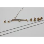 An 18ct white gold neck chain, three pairs of gold ear studs, and a pearl bar brooch