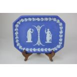 A Wedgwood pottery jasper ware octagonal dish depicting two classical female figures within oak leaf