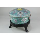 A Chinese porcelain circular pot and cover, turquoise ground, decorated with panels of birds and