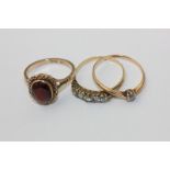 An old cut diamond five stone ring, an old cut diamond ring, a garnet ring in 9ct gold