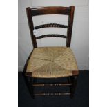A 19th century oak rush seat chair with bobbin turned supports