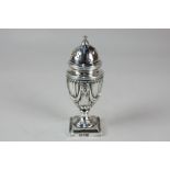A Victorian silver pepper of baluster form with roundel and swag design, makers Hawksworth, Eyre &