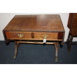 A small oak sofa table with two drawers, on brass paw castors, 100cm wide fully open