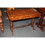 A Victorian walnut inlaid fold-over card table with rectangular shaped swivel top, with carved