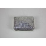 A Continental white metal rectangular snuff box with copper inset lid, engraved with a pastoral