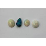 An unmounted black opal, the pear shaped stone with three unmounted white opals