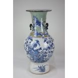 A Chinese crackle ware vase, baluster form, decorated in blue with birds and butterflies amongst a