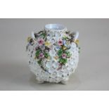 A small porcelain two-handled vase, globular form with floral encrusted decoration and gilt
