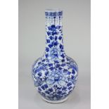 A Chinese porcelain blue and white baluster vase decorated with a pair of dragons amongst