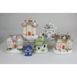 Five various Staffordshire pottery models of cottages, most pastille burners, largest 15cm, together