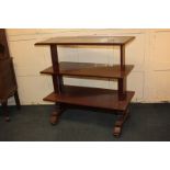 A Victorian mahogany metamorphic three-tier buffet with retractable action to form a rectangular