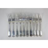 A set of seven George III Irish silver fiddle pattern table forks with engraved armorials, maker