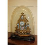 A 19th century French porcelain and ormolu mantel clock, the painted dial with Roman numerals, the