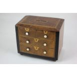 A Victorian walnut inlaid and ebonised chest of drawers money box, of bowfront form, with two