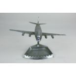 An Art Deco metal ashtray / desk ornament modelled as an aeroplane, 14.5cm high