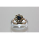 A sapphire and old cut diamond cluster ring in 18ct yellow gold