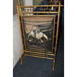 A 19th century Japanese fire screen, the gilt bamboo surround with silk embroidered panel