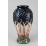 A Moorcroft pottery baluster vase in the Cluny pattern, 26cm high