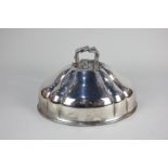 A silver plated oval tureen cover, domed and fluted with central handle cast as crossed branches