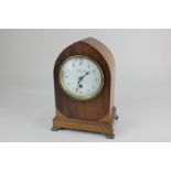 An Edwardian mahogany lancet shaped mantel clock white enamel dial, marked Camerer, Kuss & Co, 186